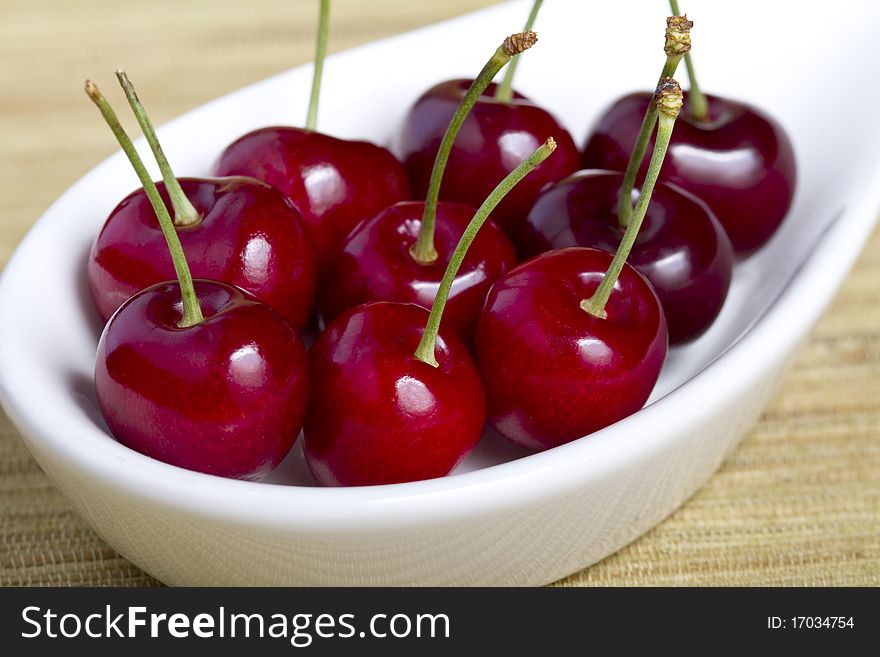 Close Up Cherries In White Bowl