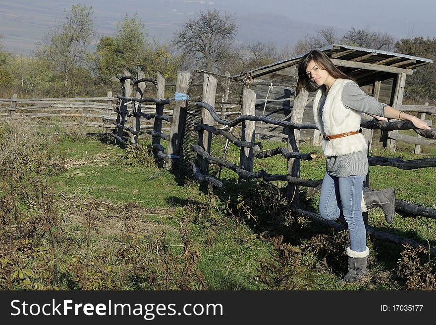 Beautiful white girl enjoying fall season in countryside area. Beautiful white girl enjoying fall season in countryside area