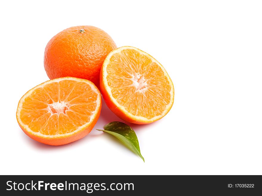 Ripe tangerines with leaves and slices