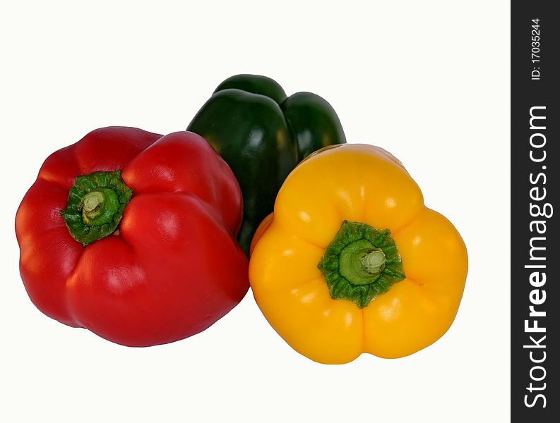 Multi-colored pepper on a white background. Multi-colored pepper on a white background