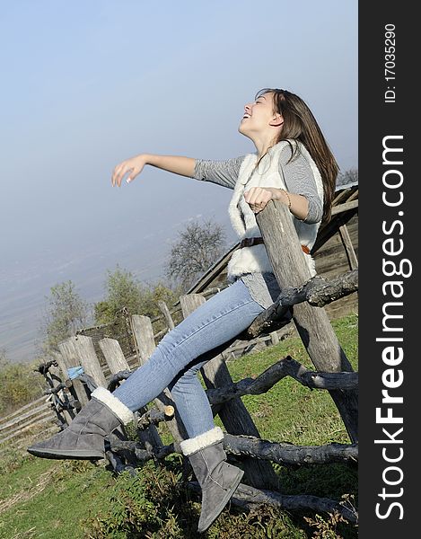 Happy woman laughing outside