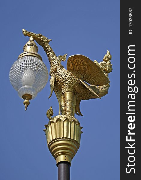 Lighting pole with thai golden bird