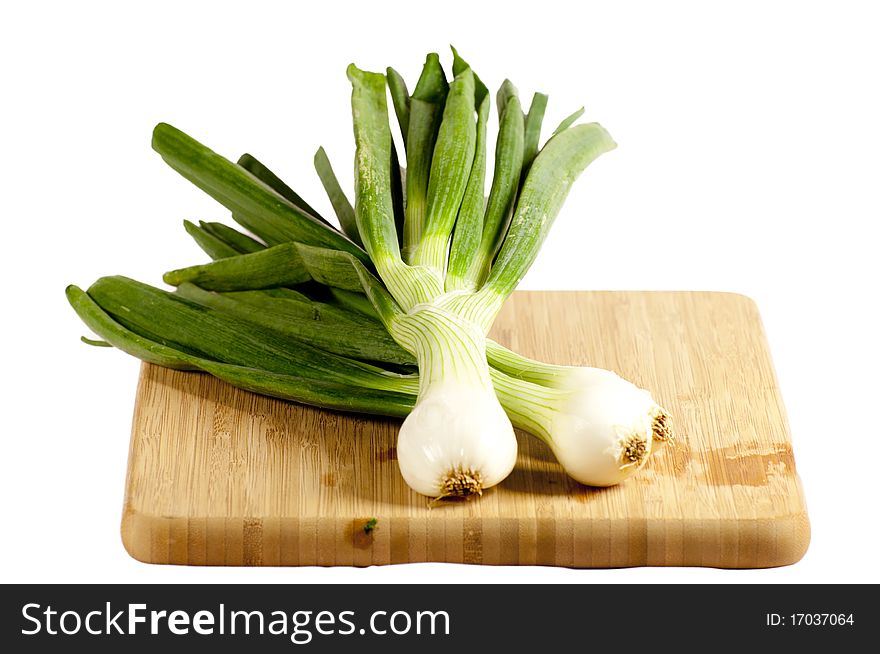 Several vegetables on a wooden cutting board. Several vegetables on a wooden cutting board