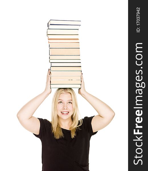 Young woman with a pile of books on her head isolated on white background