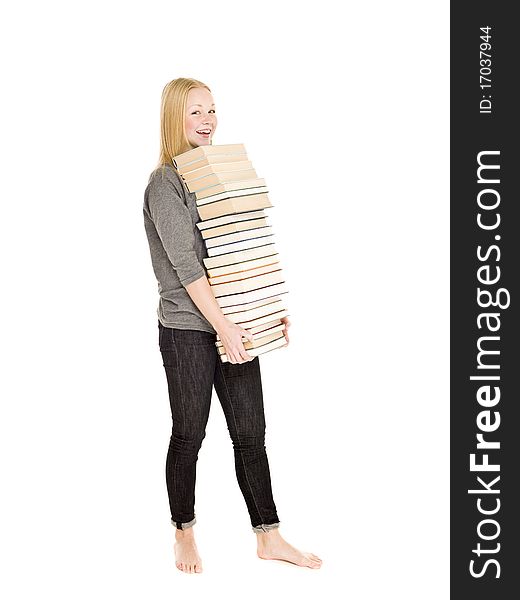 Young girl carrying a pile of books isolated on white background. Young girl carrying a pile of books isolated on white background