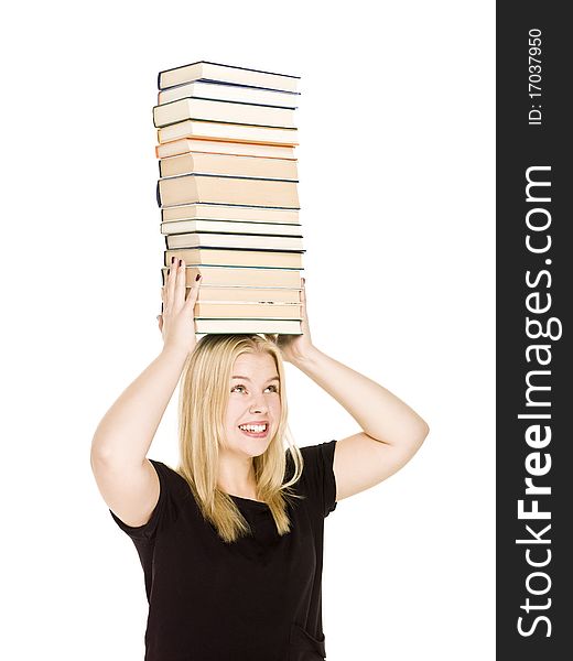 Young woman with a pile of books on her head isolated on white background