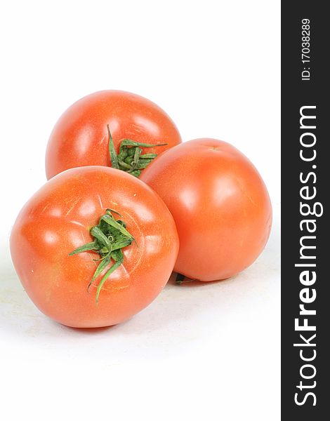 Three Red Tomato on white background