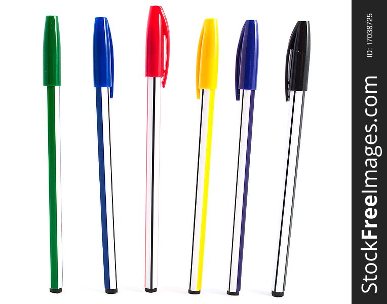 Pens of different colors on a white background