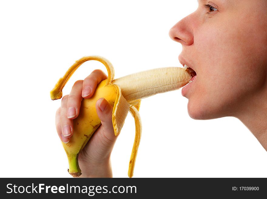 Woman's hands and lips with yellow banana