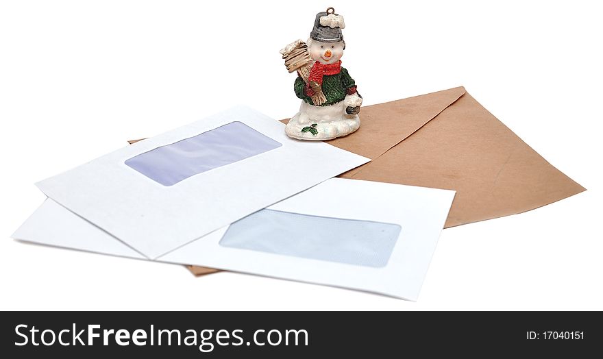 Christmas toy snowman on a background of empty envelopes