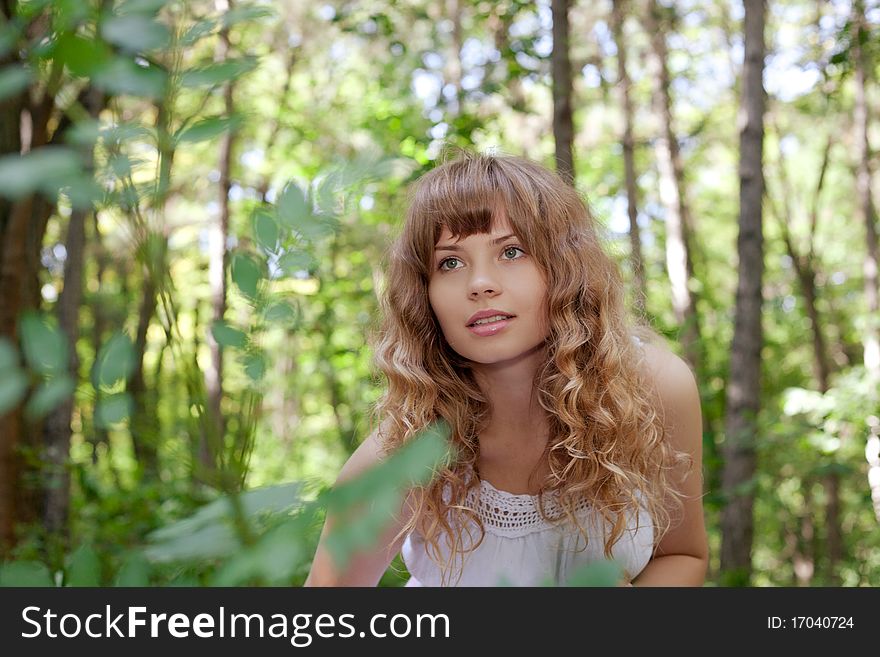 Pretty woman posing in forest. Pretty woman posing in forest