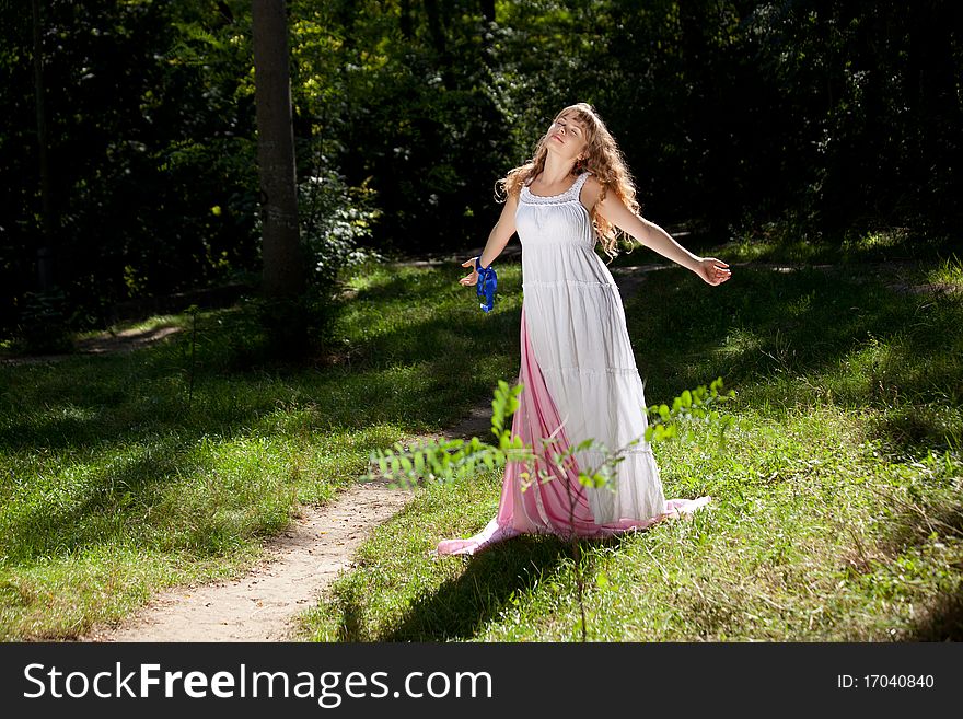 Pretty woman posing in forest. Pretty woman posing in forest