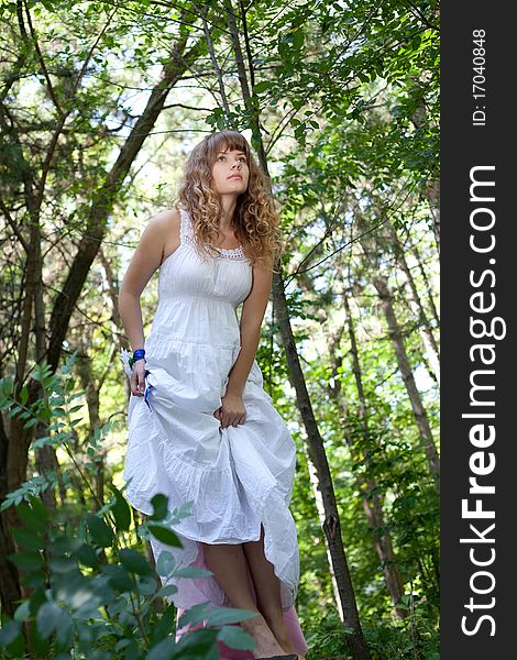 Pretty woman posing in forest. Pretty woman posing in forest