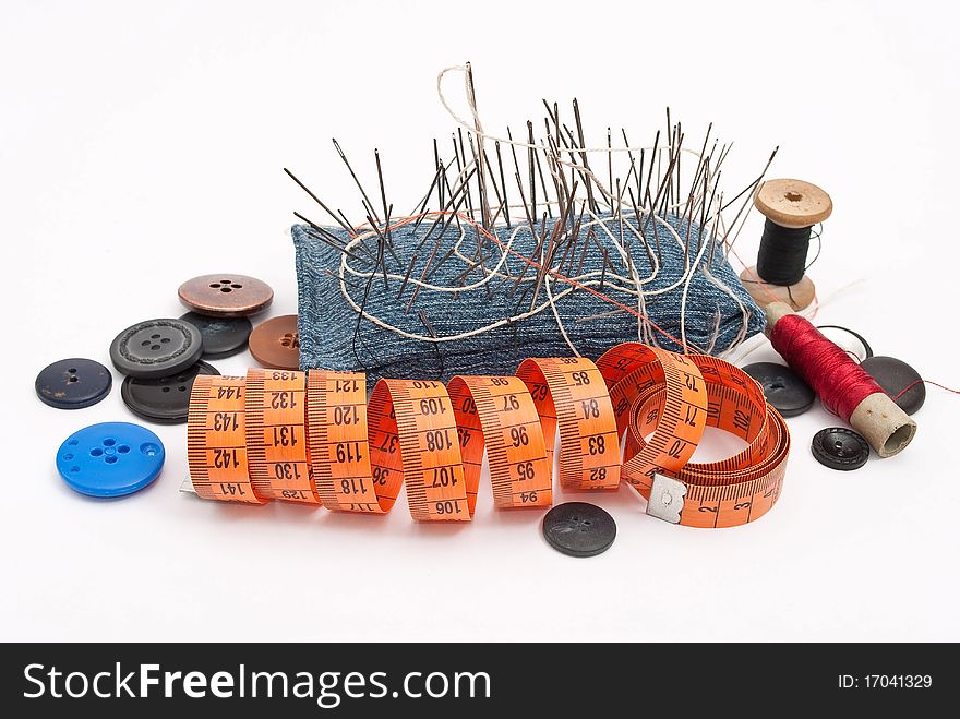 Sewing tools on white background