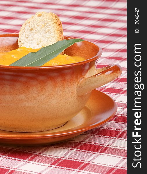 Cream of squash soup in a casserole pot.
