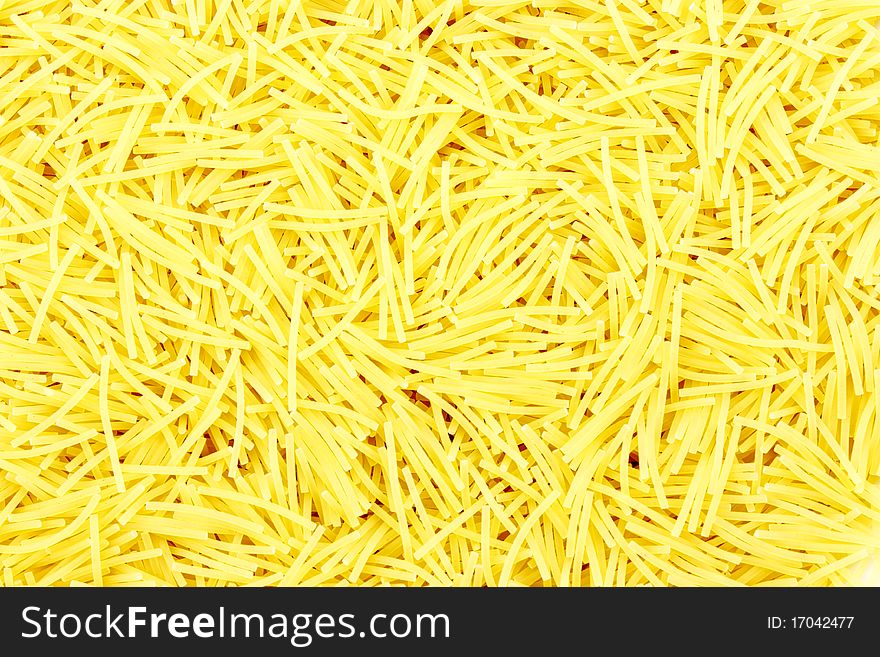 Macaroni products vermicelli as a background.