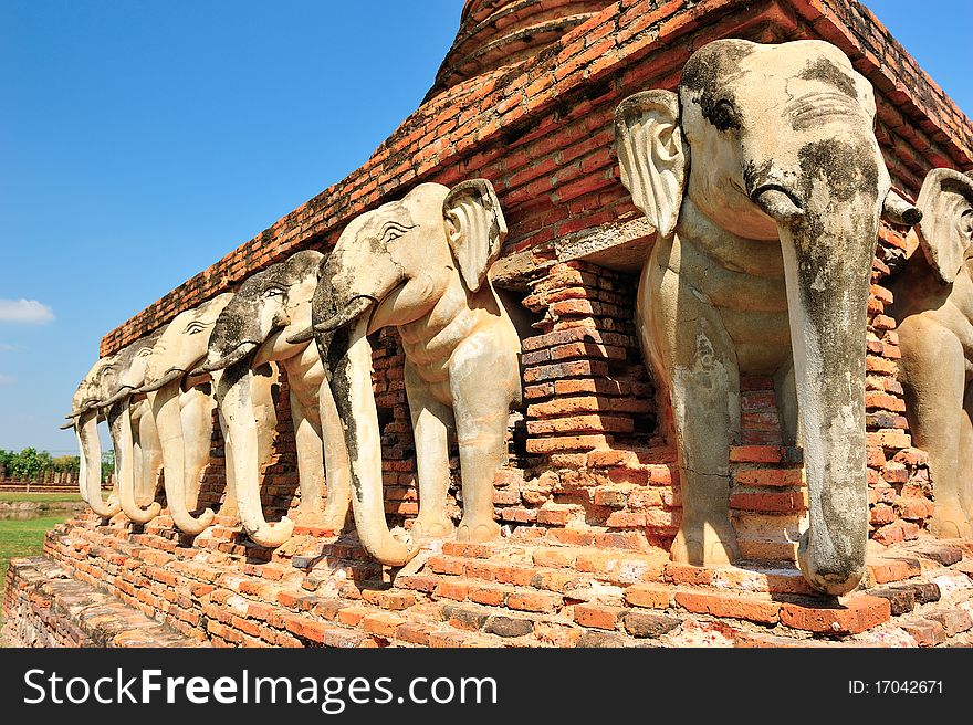 Elephant statue around pagoda at Sukhothai historical park