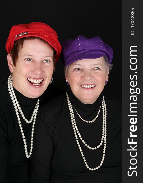 Adult mother and daughter wearing red and purple hats