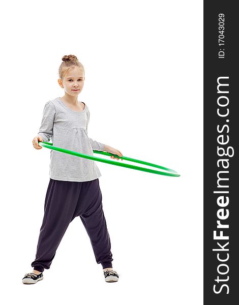 Sporty little girl with hula hoop posing on a white background. Sporty little girl with hula hoop posing on a white background