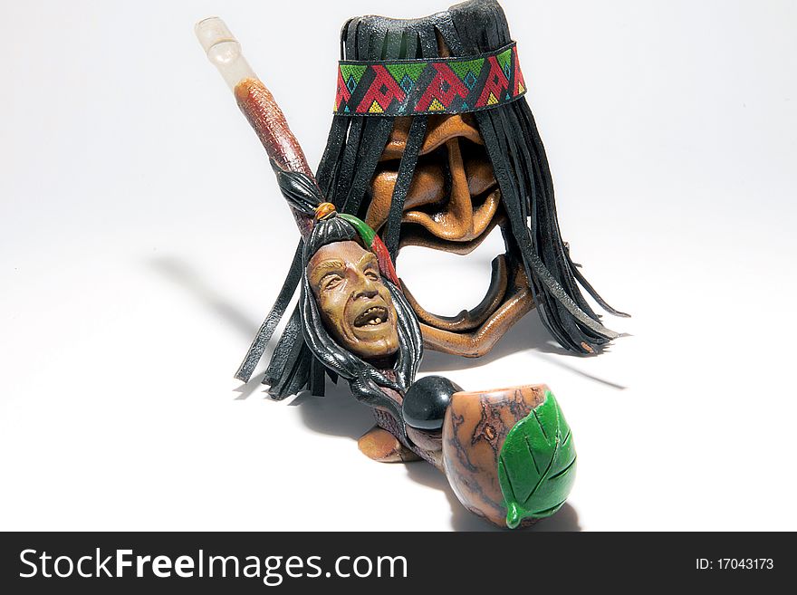 American indian toy mask of  and peace rod. American indian toy mask of  and peace rod