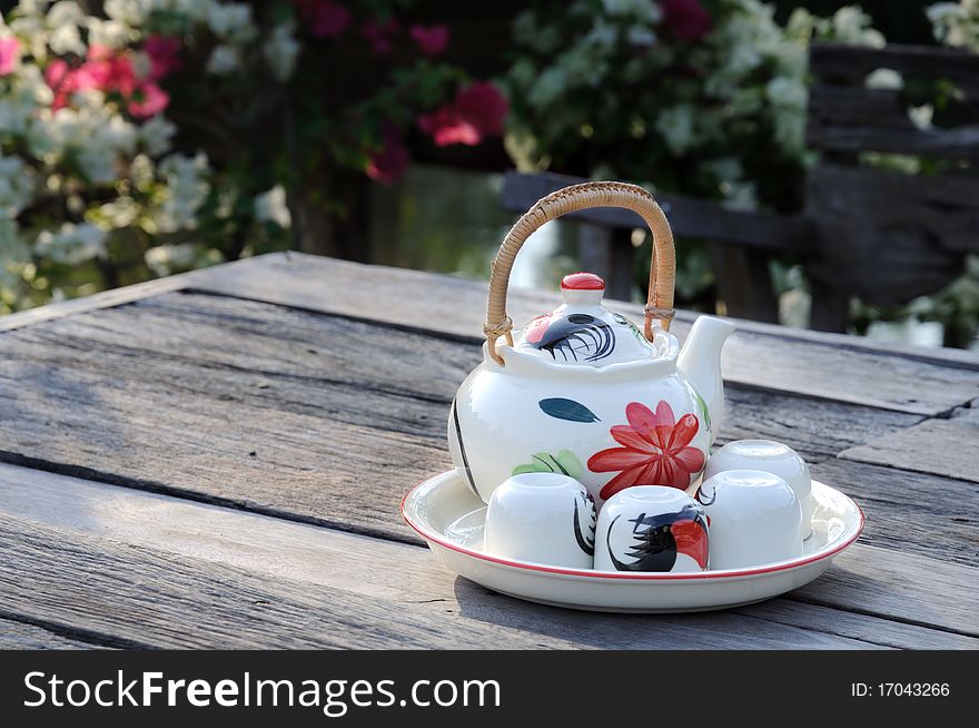 Teapot and cups on the table in the morning. Teapot and cups on the table in the morning.