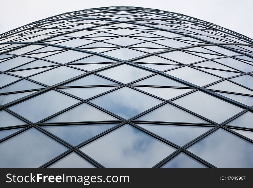 Detail shot from Foster & Partners building Swiss Re, revealing the clouds and sky reflections on the glass façade. Detail shot from Foster & Partners building Swiss Re, revealing the clouds and sky reflections on the glass façade