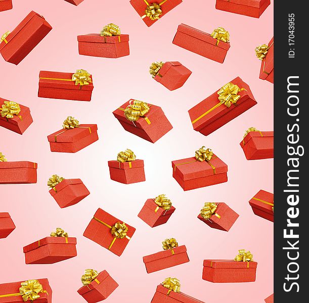 Red gift boxes with ribbon and bow on pink background