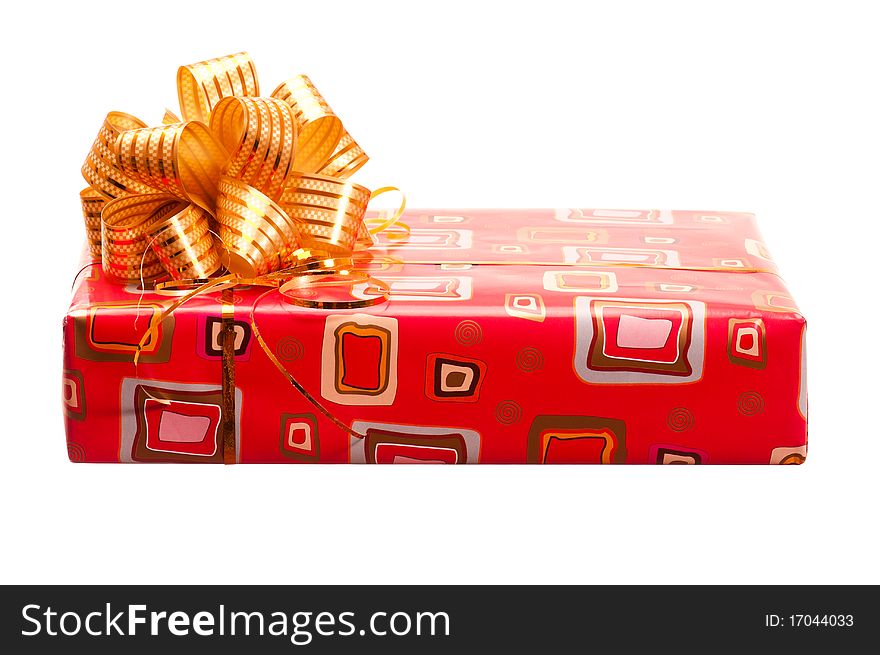 Red gift box with ribbon and bow on white background