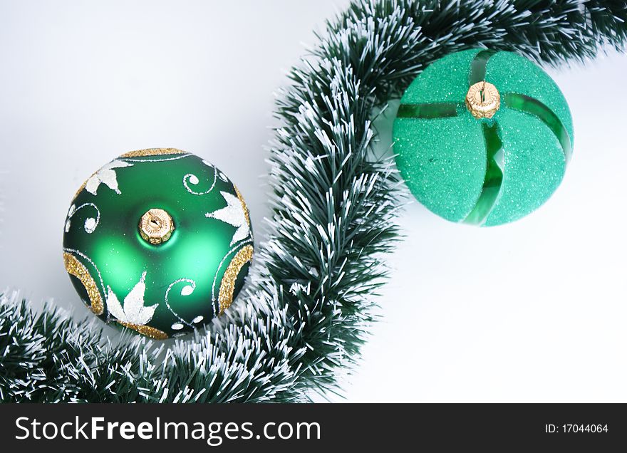 Christmas tree decoration, two green balls, white background
