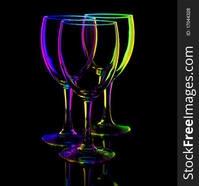 Three empty wine glasses, isolated on black. Three empty wine glasses, isolated on black