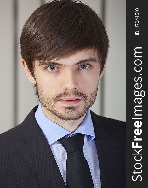 Portrait of young businessman in a office