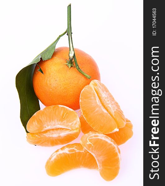 Mandarin with leaves and slices on white background. Mandarin with leaves and slices on white background