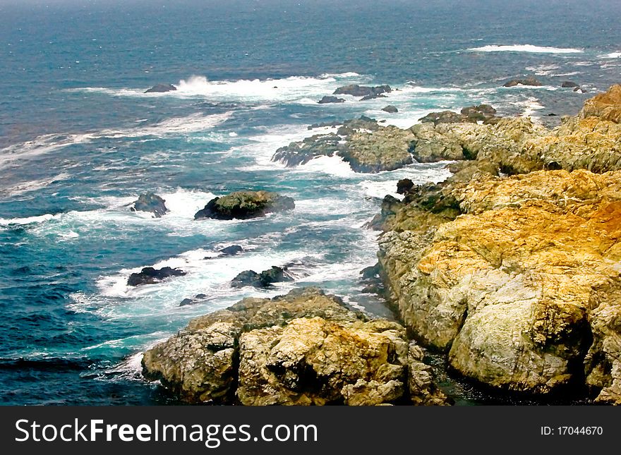 Seascape photo consists of rocky shore with scenic view of rocks, cliffs and waves. Seascape photo consists of rocky shore with scenic view of rocks, cliffs and waves.