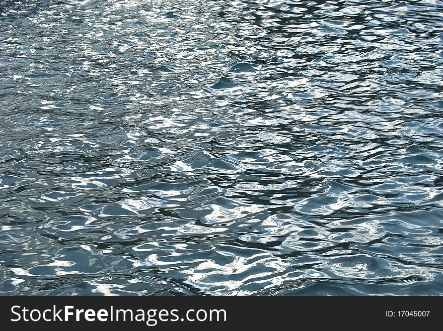 Wavy water background with oil pollution. Wavy water background with oil pollution