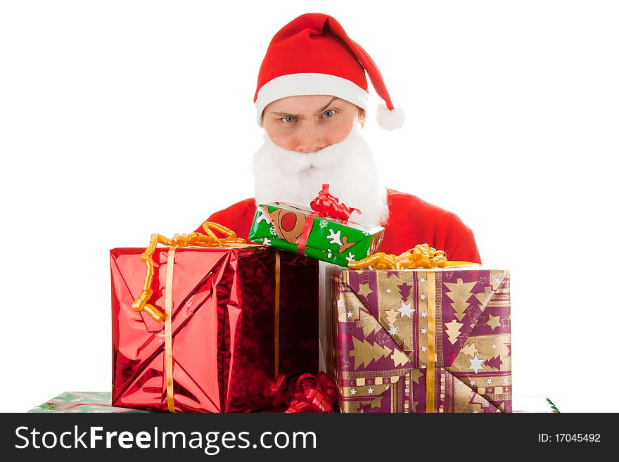Santa Claus loaded with Christmas gifts