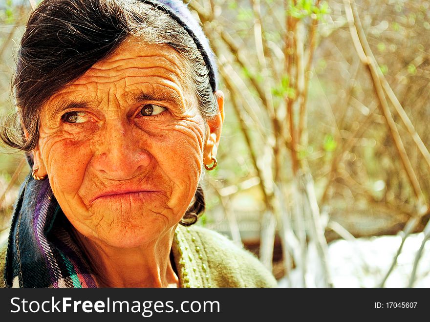 Old woman with dark bandana smiling. Old woman with dark bandana smiling