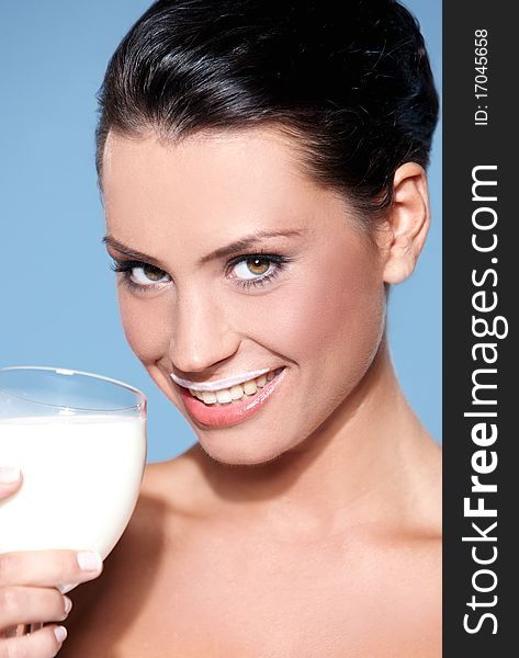 Portrait of beautiful woman, she holdin glass of milk. Portrait of beautiful woman, she holdin glass of milk