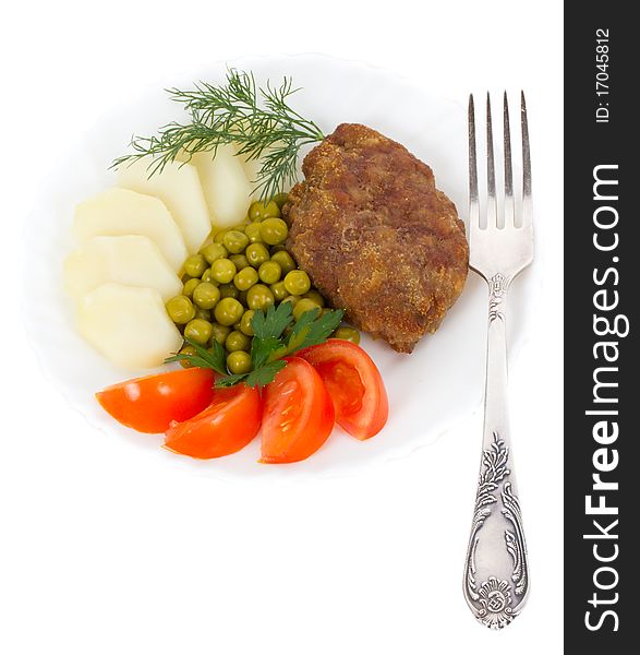 Close-up schnitzel with vegetables, isolated on white