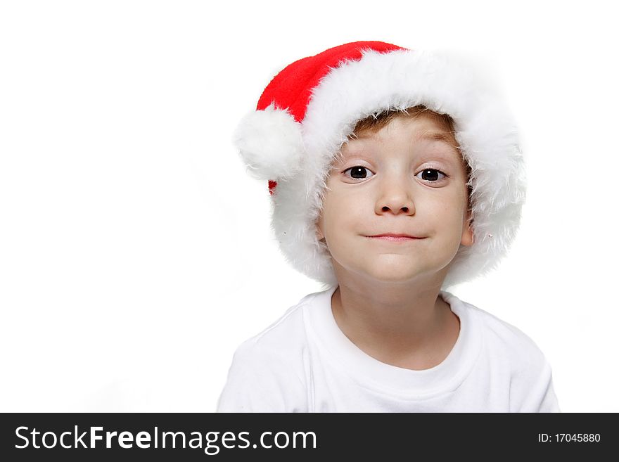 Studio portrait of funny child in santa hat