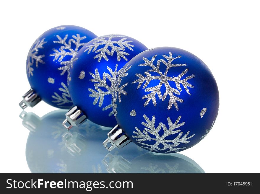 Close-up christmas decorations with reflection, isolated on white