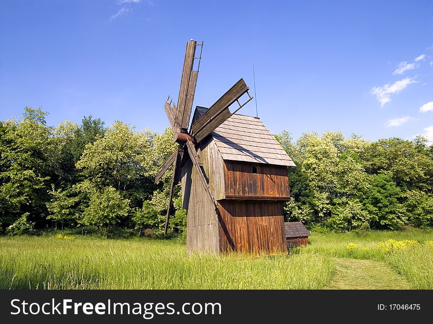 Windmill On Green Field