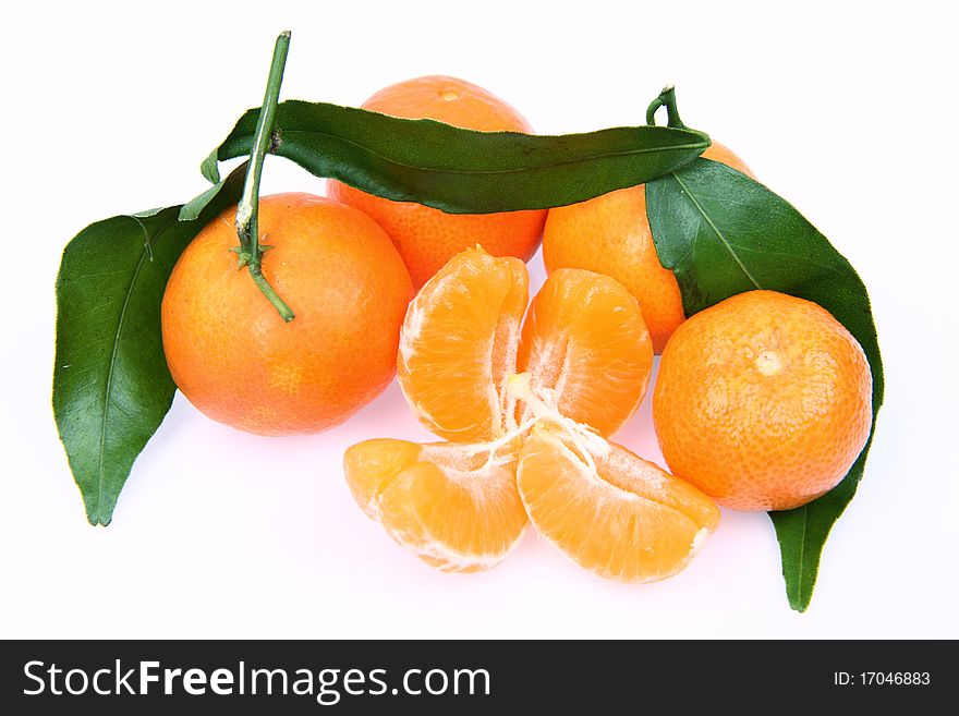 Mandarin oranges one peeled, on white background