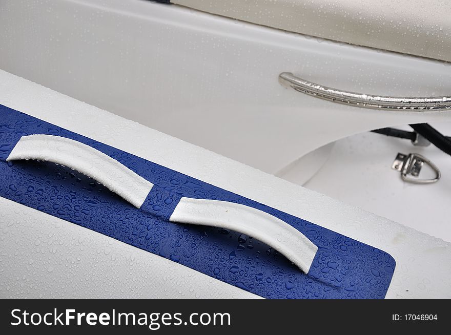 Strip detail of a rubber light boat in wetness, shown as marine sport and entertainment. Strip detail of a rubber light boat in wetness, shown as marine sport and entertainment.