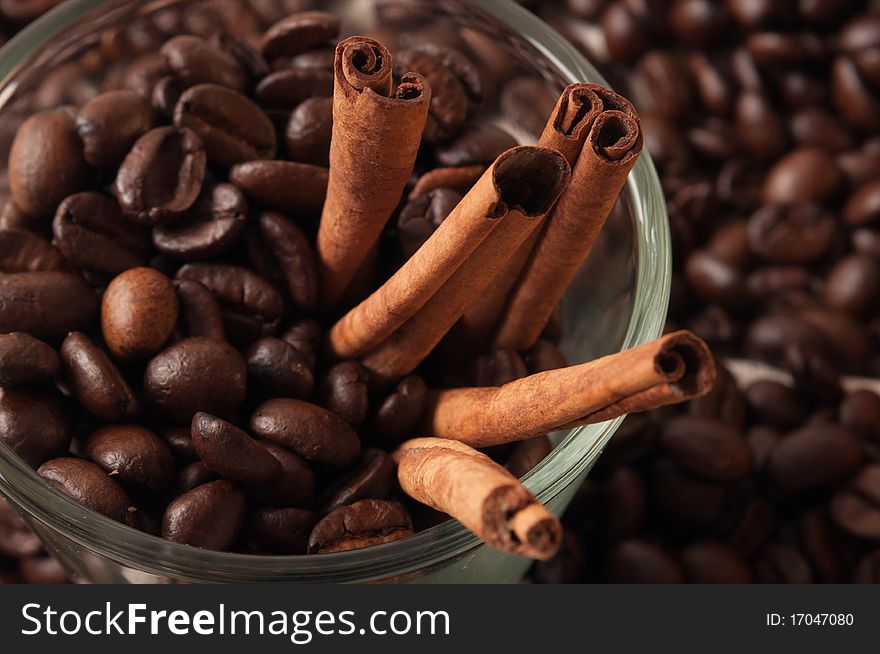 Cinnamon rolls in coffee beans closeup