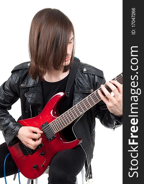 Rocker playing guitar isolated on white background