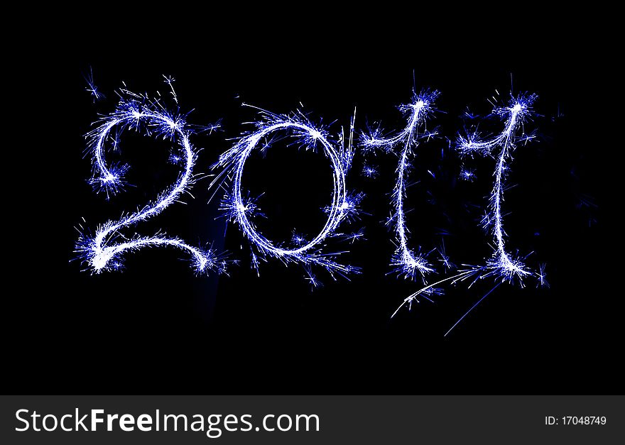 Burning sparkler on New Yearï¿½s Eve. Burning sparkler on New Yearï¿½s Eve