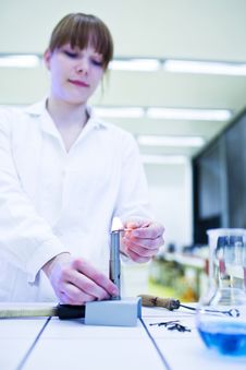 Female Researcher Lighting Up A Burner Royalty Free Stock Images Female Researcher Lighting Up A Burner Royalty Free Stock Images