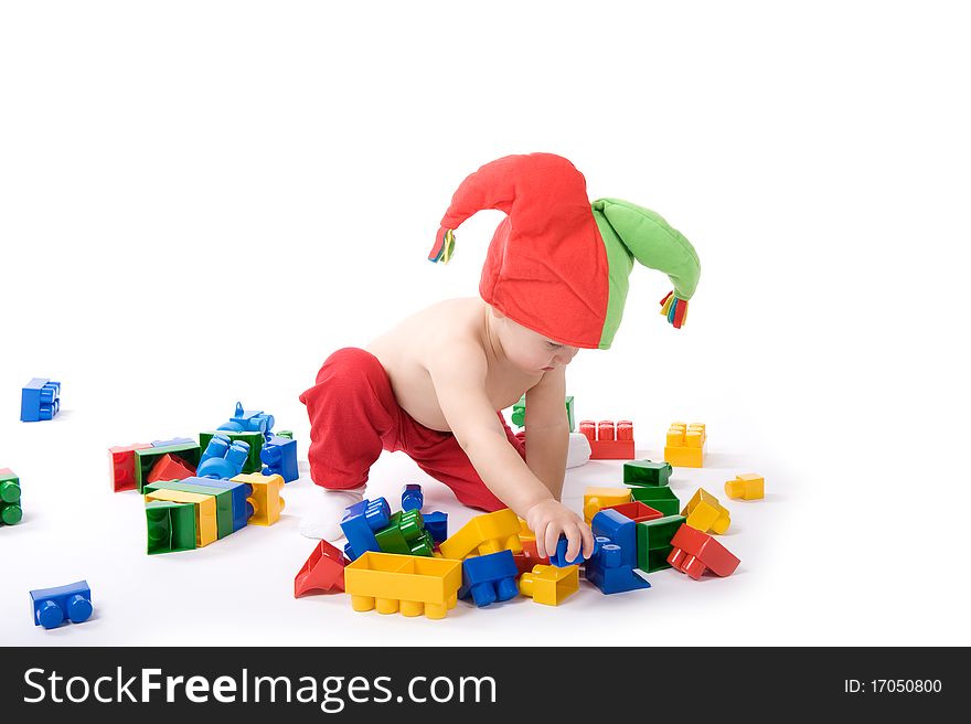 Little girl is sitting on the floor and playing with blocks. Little girl is sitting on the floor and playing with blocks