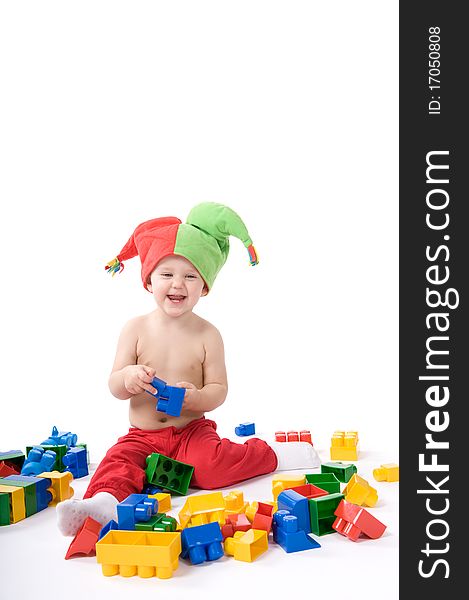 Little girl is sitting on the floor and playing with blocks. Little girl is sitting on the floor and playing with blocks