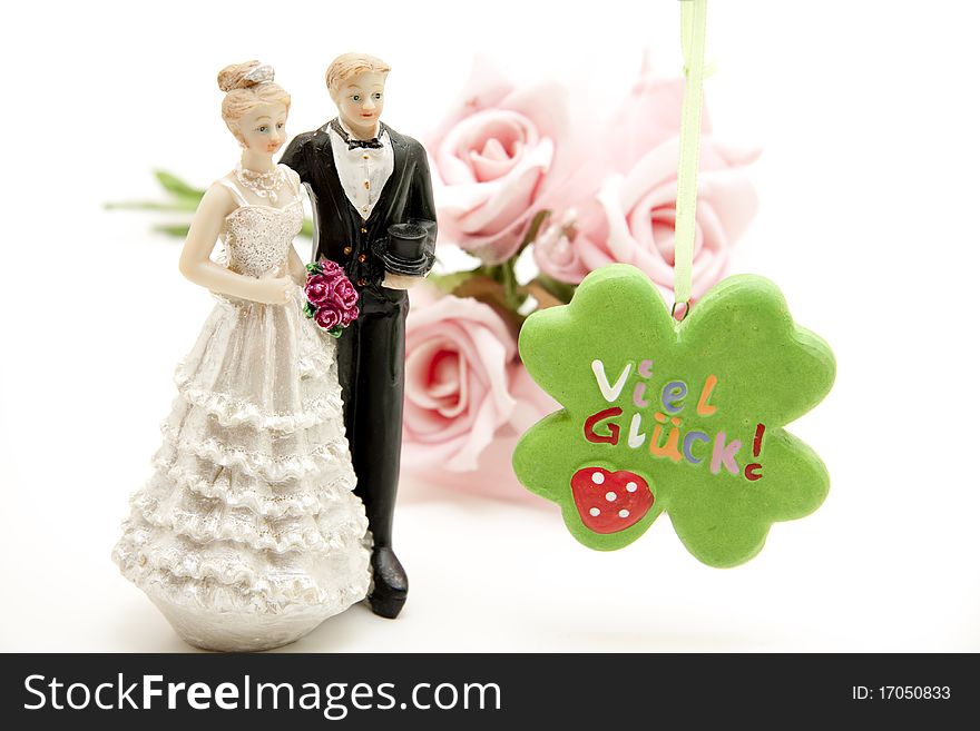 A lot of luck for the bridal couple with bunch of roses